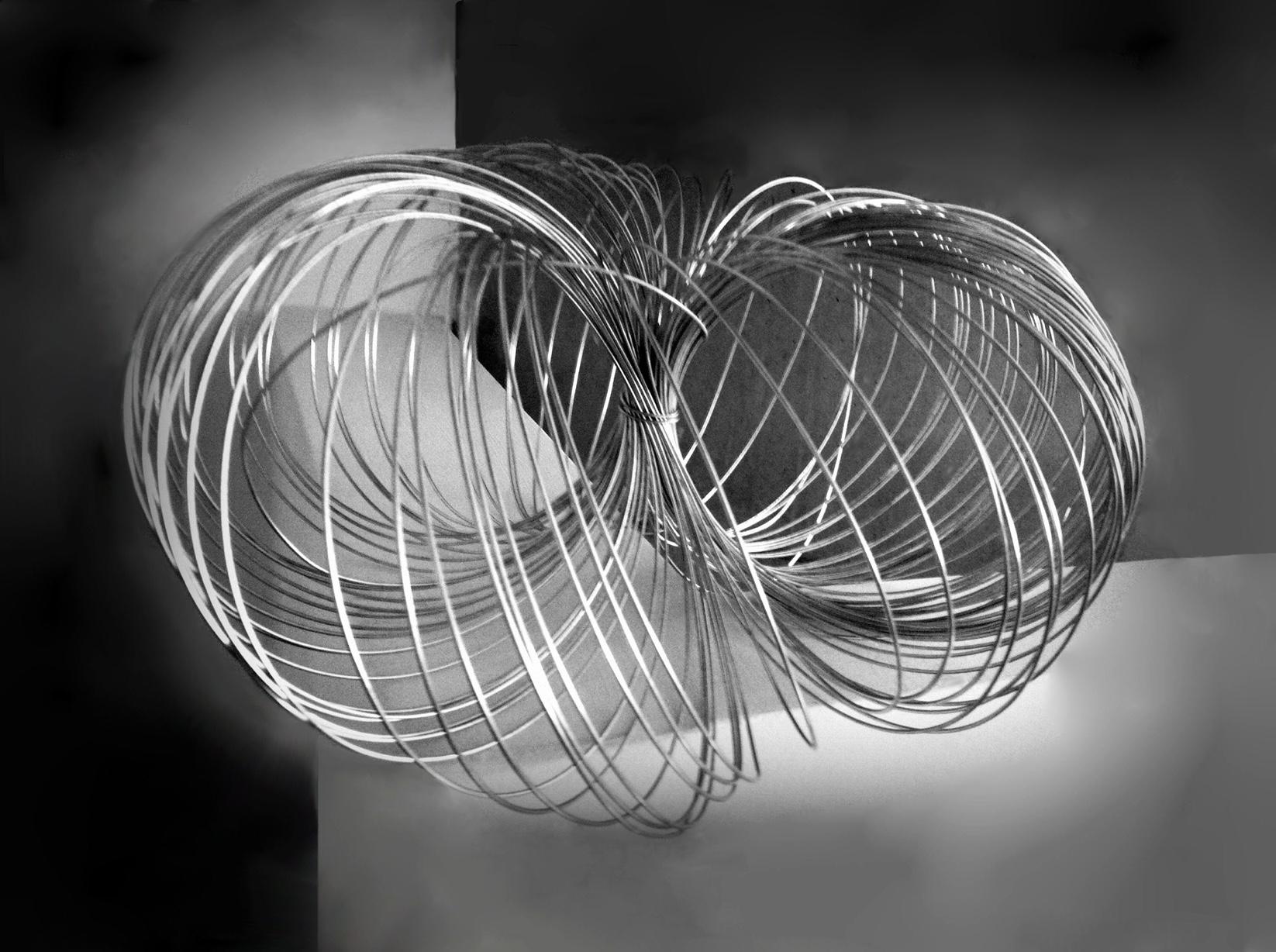 Monochrome image of coiled wire in space